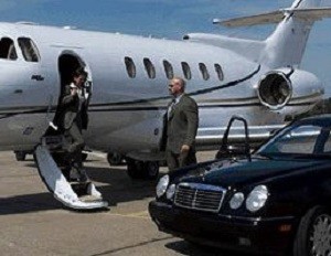 A picture of the Chief Instructor picking up a client from a private jet while working as a bodyguard