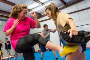 A picture of two girls training at the free introductory class