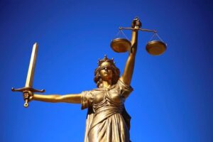 A picture of the scales of justice being used to show the importance of understanding the law as it pertains to self-defense